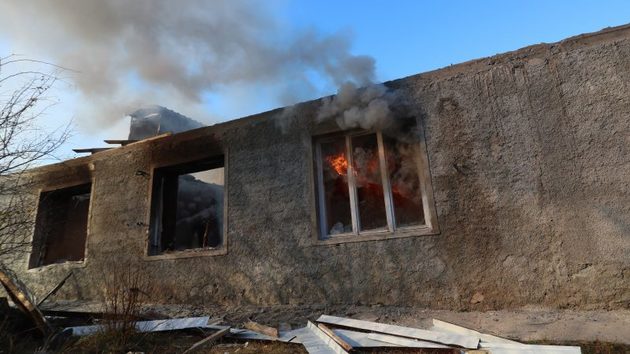 A house burns in the town of Kalbajar in Kalbajar region, Azerbaijan, 24 November 2020, before the handover of the region under Azerbaijan's control