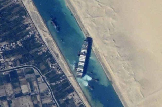 Suez Canal: Effort to refloat wedged container ship continues
