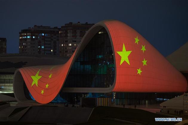 The Heydar Aliyev Center is lit up with the image of the Chinese national flag to support China's efforts in fighting against the COVID-19 outbreak, Baku, Azerbaijan, April 3, 2020.