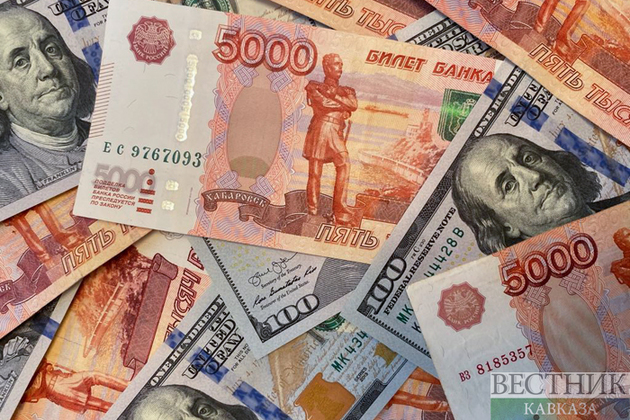 Russian ruble firms past 52 against U.S. dollar, hits 7-year peak