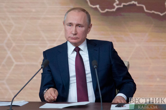 Putin signs laws admitting four new regions to Russia