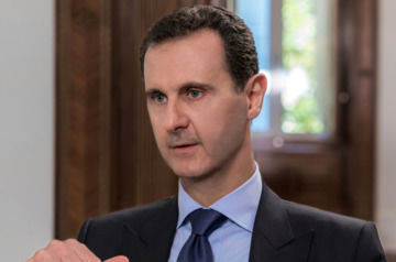 Assad interrupts speech after brief drop in blood pressure