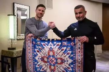 Qarabag coach presents Bayer coach unique carpet