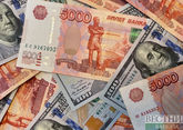Russian ruble firms to 7-year high past 53 vs dollar