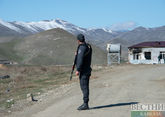 Azerbaijanis give out water to Armenians on Lachin road in Karabakh