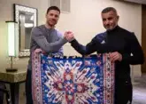 Qarabag coach presents Bayer coach unique carpet