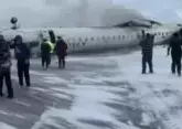 Plane flips upside down on landing at Toronto airport