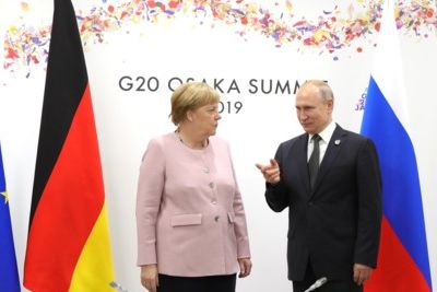 Why does Merkel need to visit Kremlin urgently?